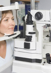 optometrist doing comprehensive eye exam